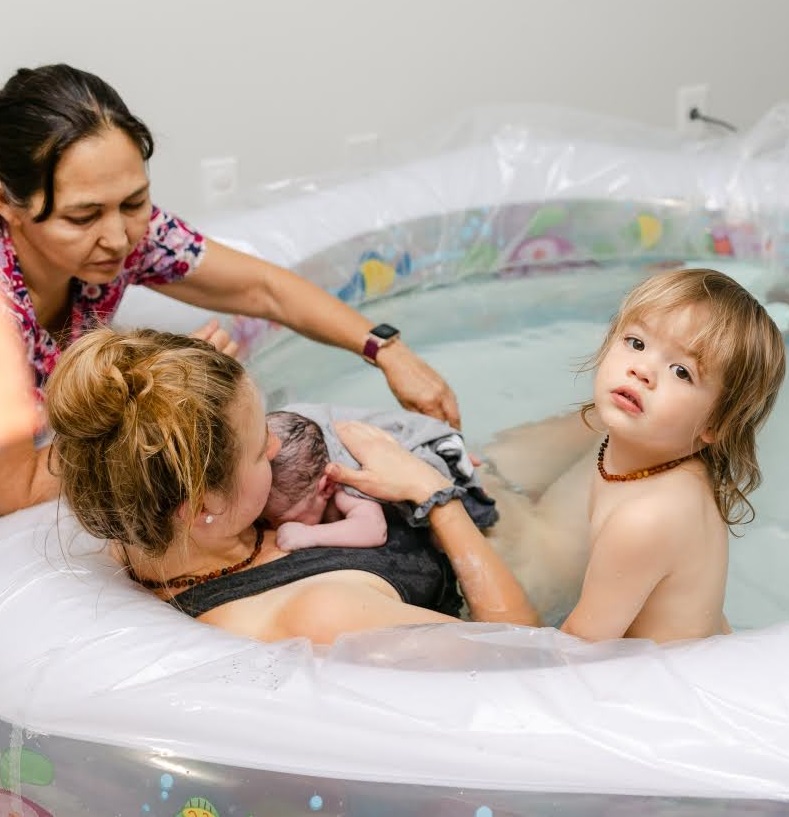 doula and mom with babies